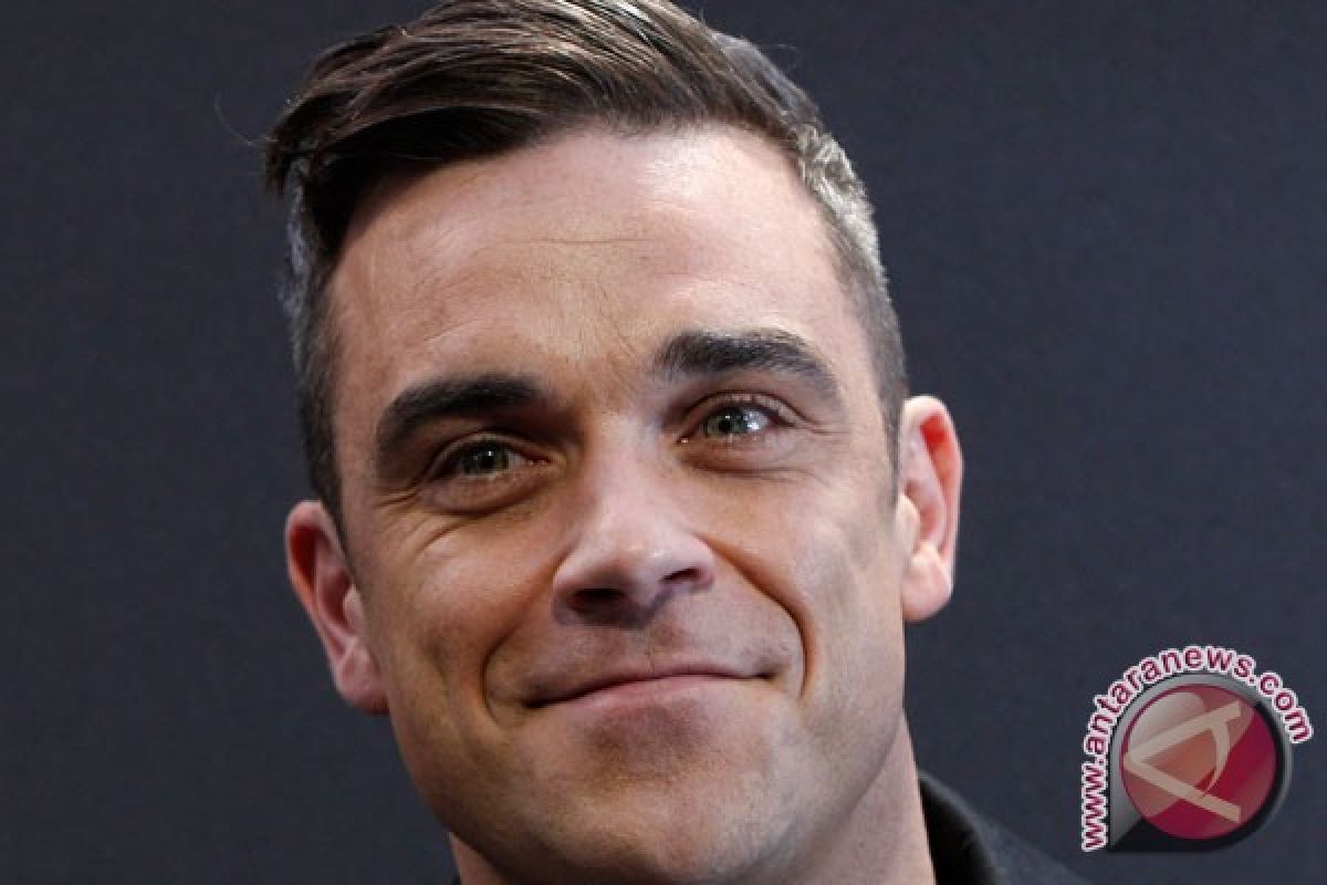 Robbie Williams sejajarkan One Direction dengan Spice Girls