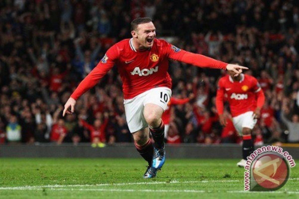 Tandukan Rooney antar United puncaki grup B