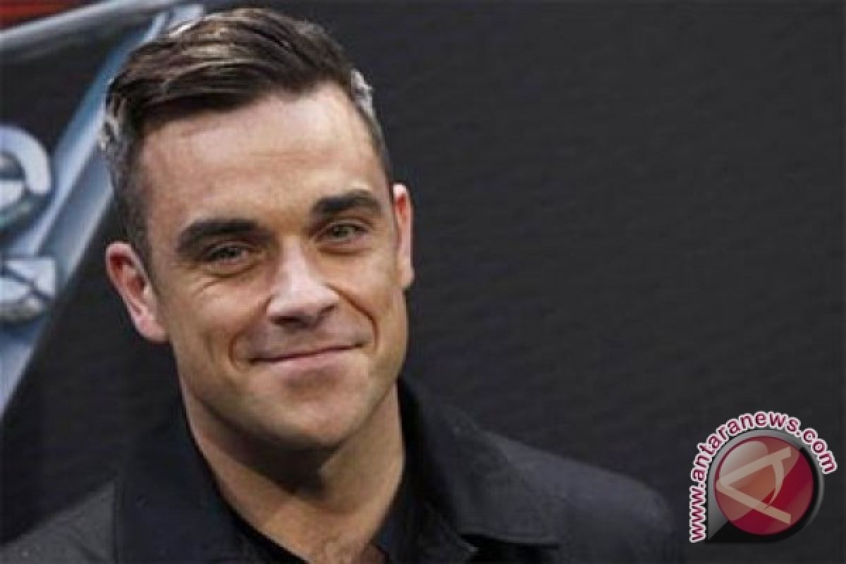 Robbie Williams dilarang nyanyikan lagu andalanya di pembukaan Piala Dunia