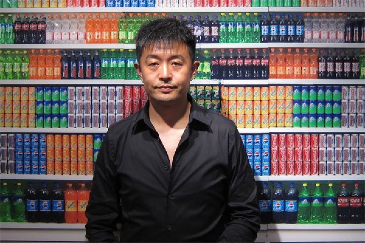 Artist Liu Bolin hides in plain sight at Beijing Theatre