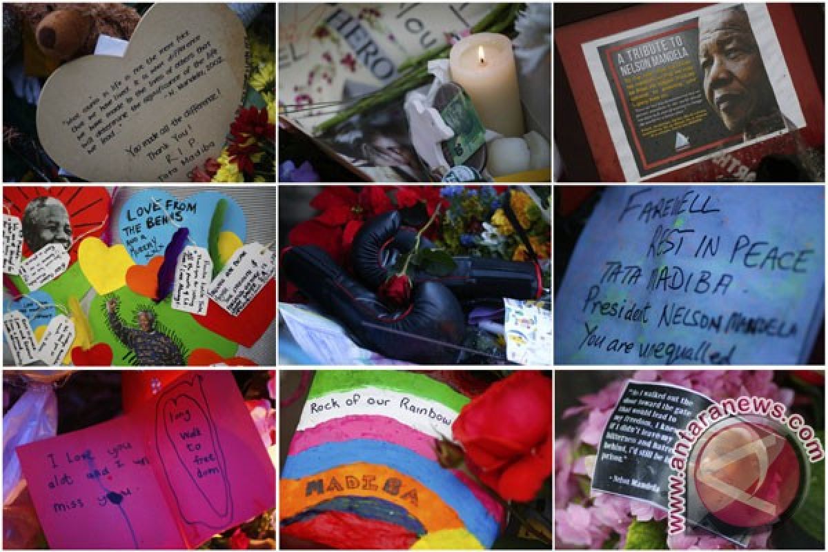 Tumpukan karangan bunga menghiasi halaman rumah Mandela