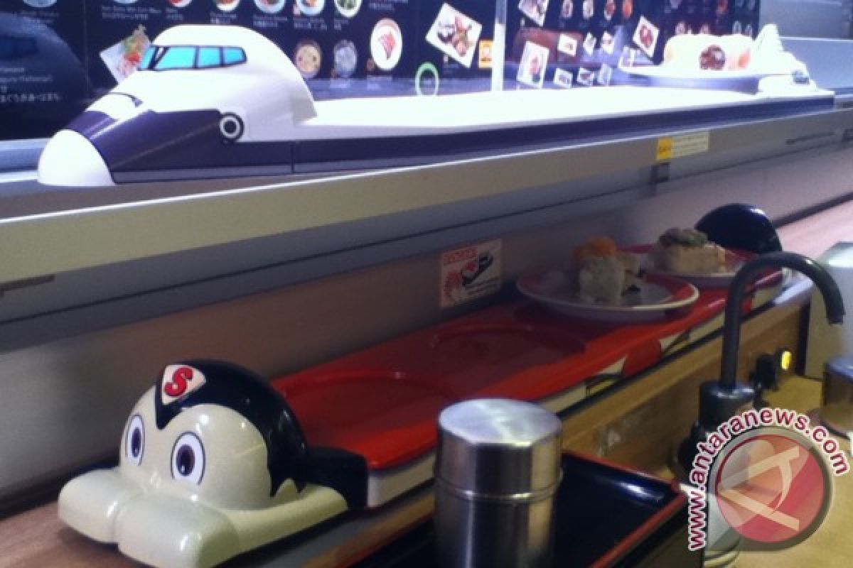 Sushi diantar Astro Boy