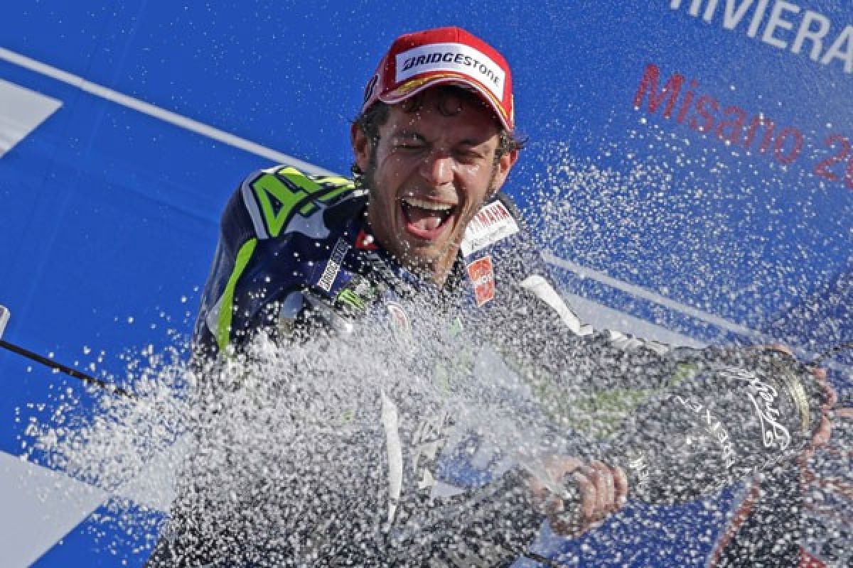 Rossi menang dramatis