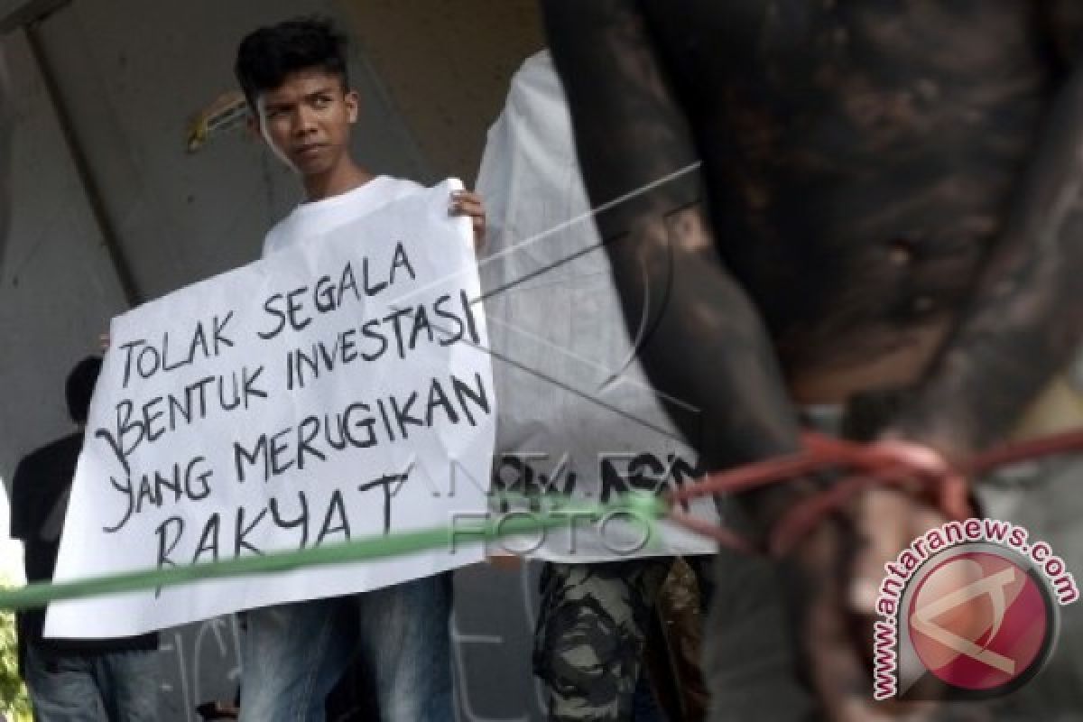 TOLAK INVESTASI KELAPA SAWIT