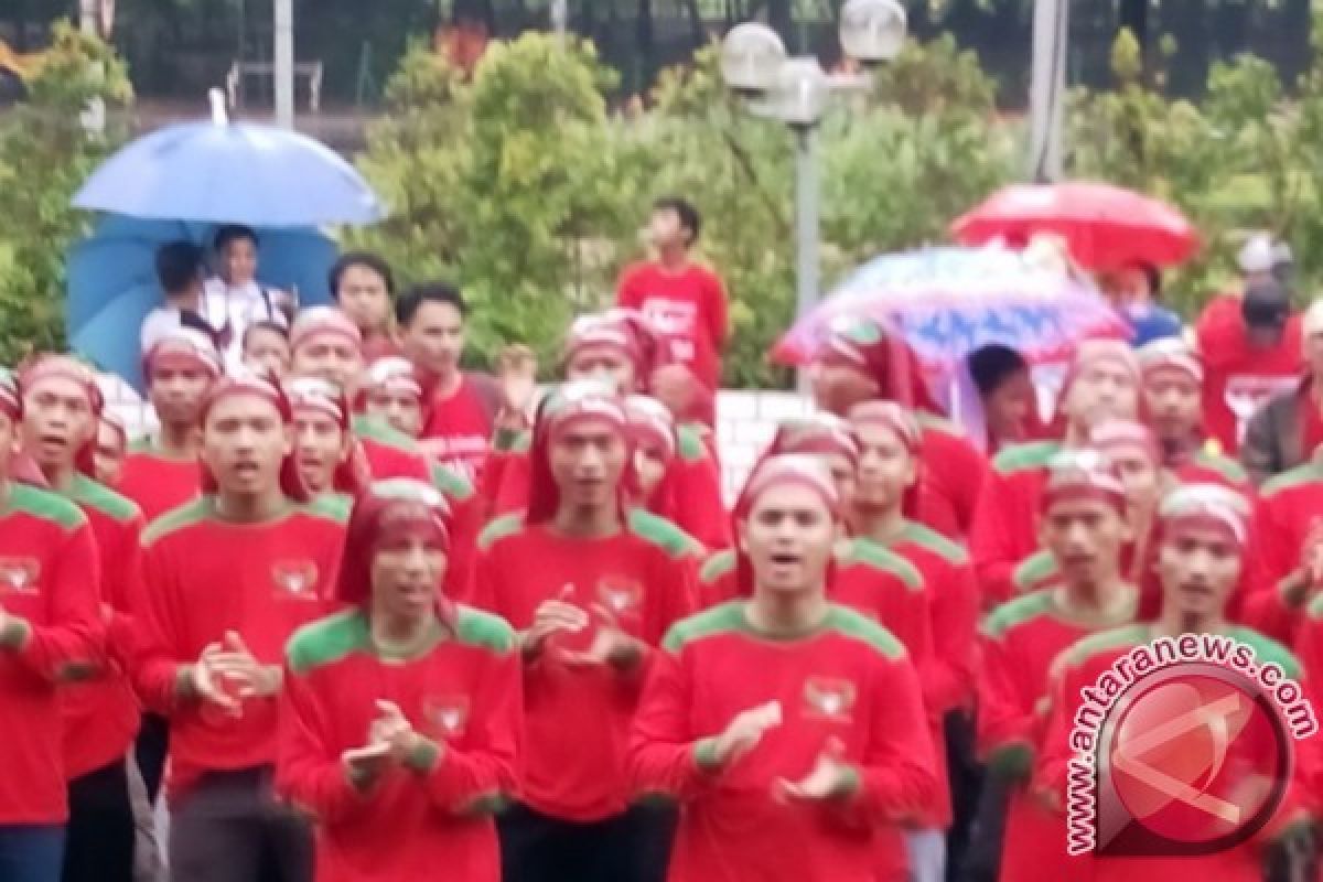 HUT Aspek Meriah Di Tengah Guyuran Hujan Deras