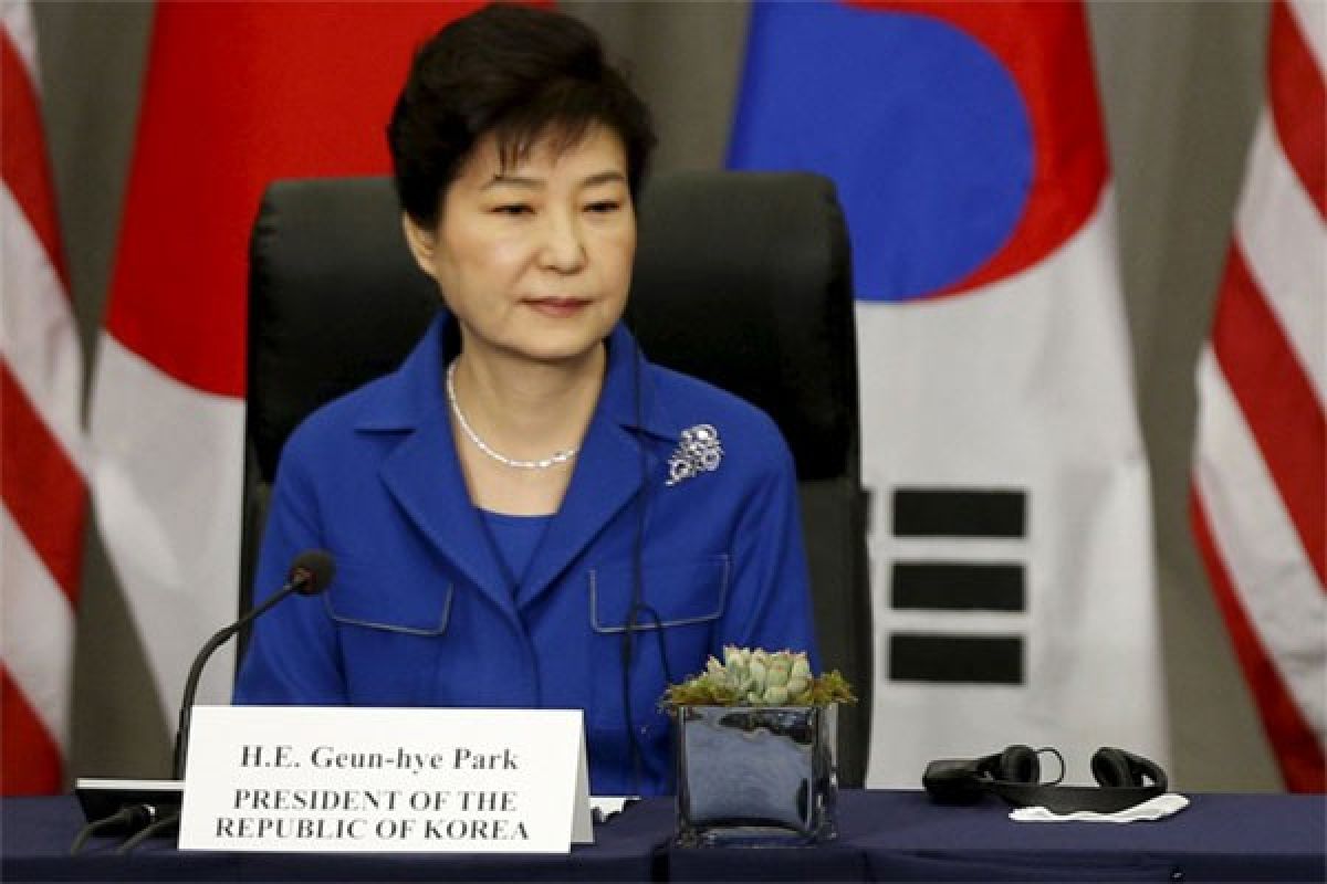 S. Korean court throws president out of office, two dead in protest