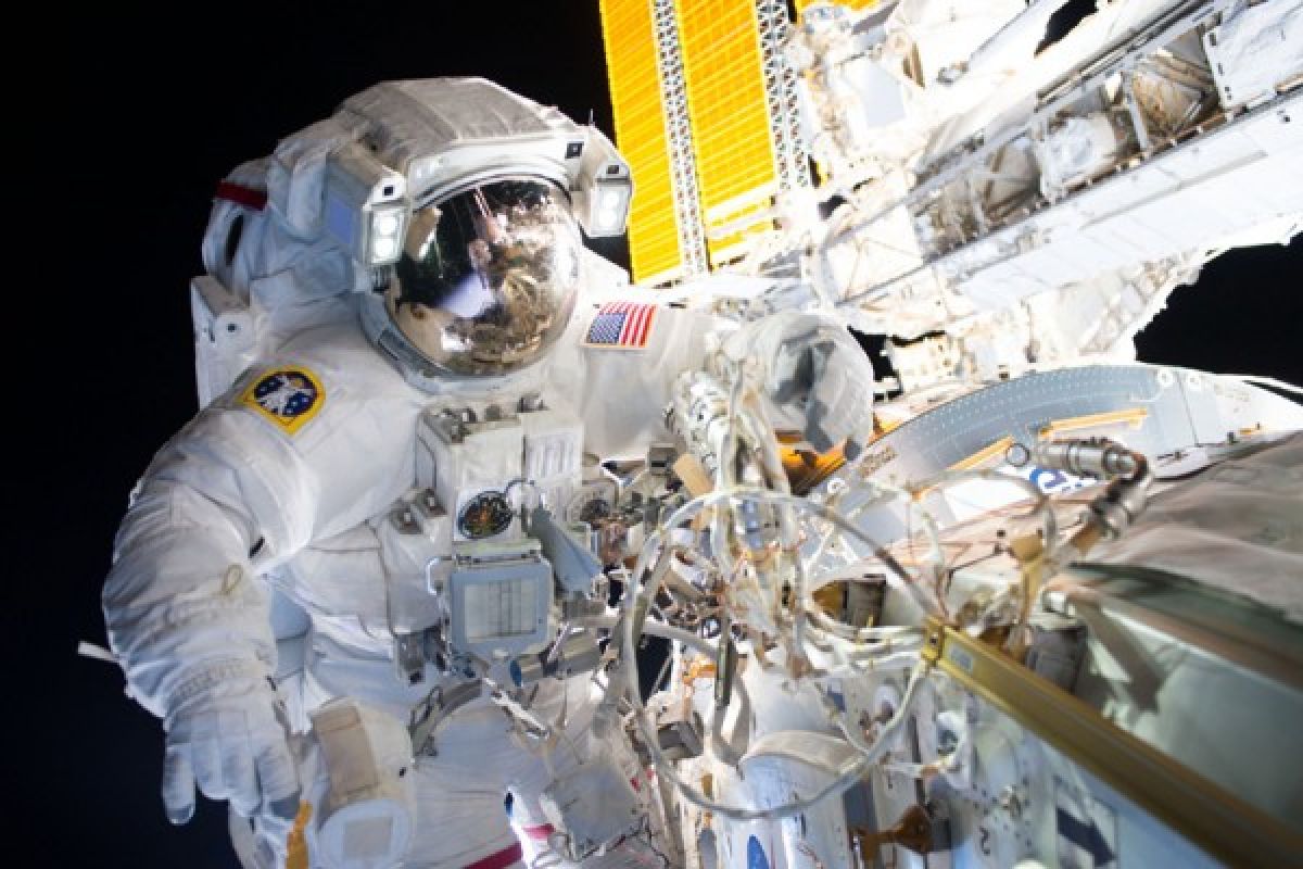 U.S. astronauts perform seven-hour spacewalk outside station