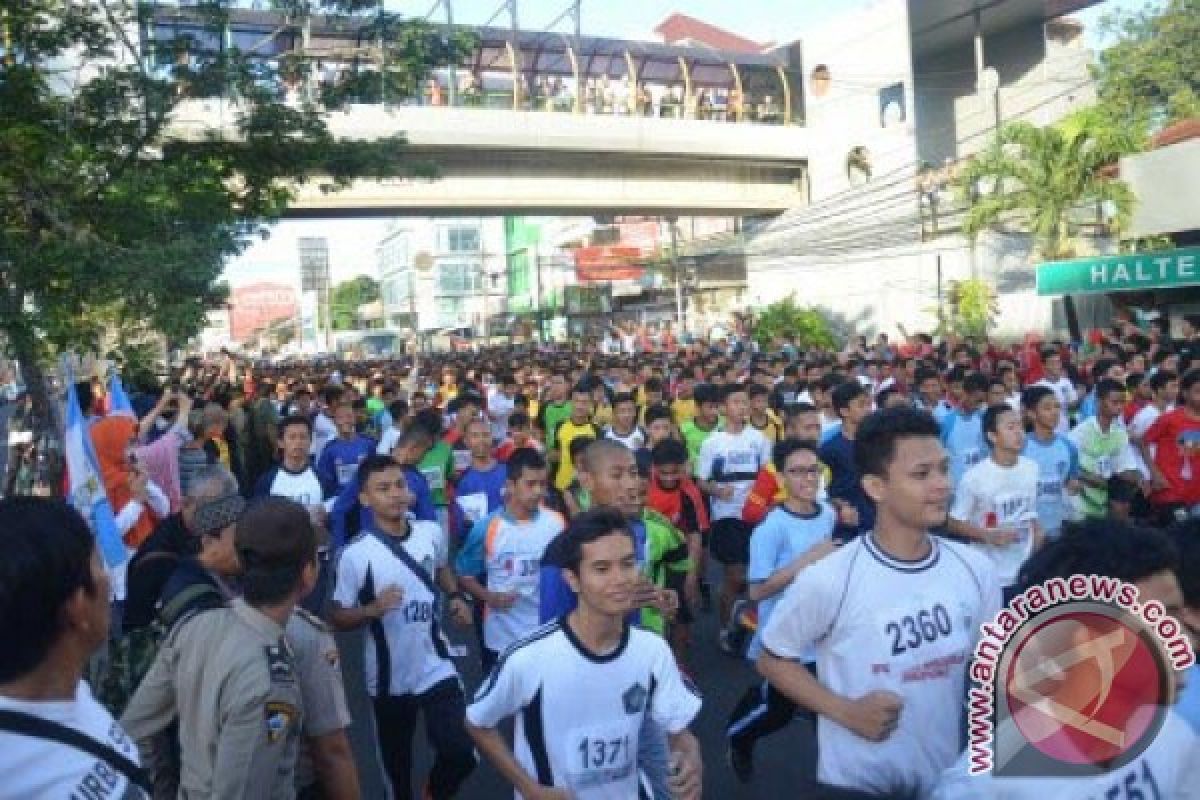 Agus Prayogo Raih Juara 10 K Depok