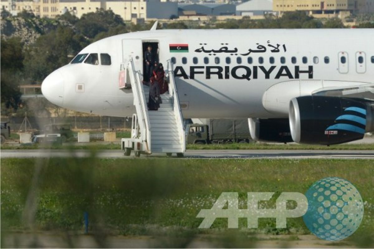 Hijacked Libyan plane lands in Malta with 118 on board