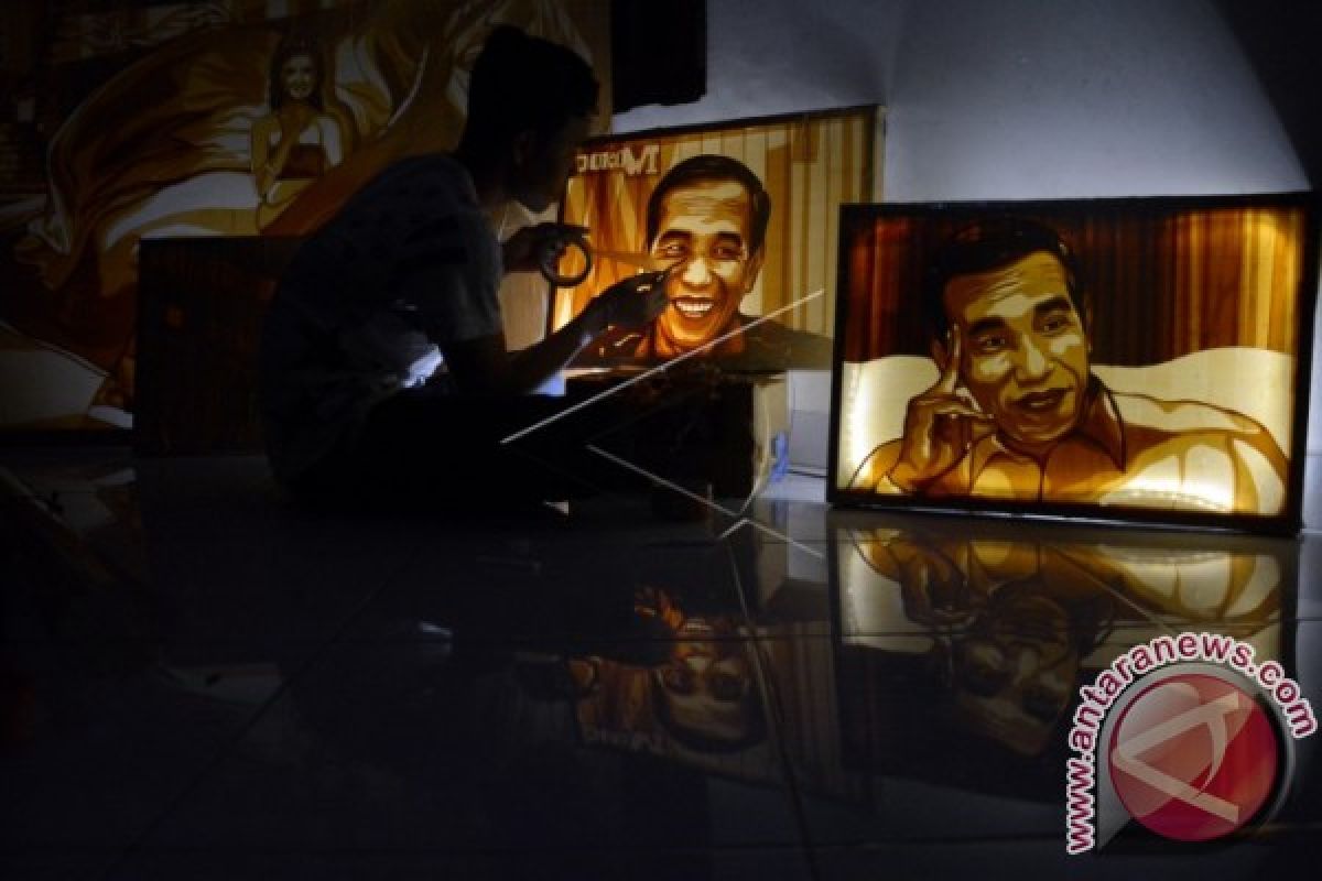 Seniman Dede Rai Rampungkan Lukisan Jokowi