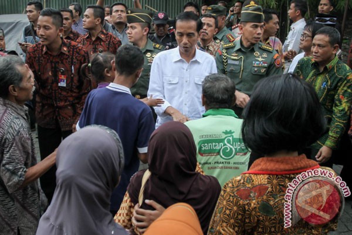 President Jokowi distributes food packages in Solo