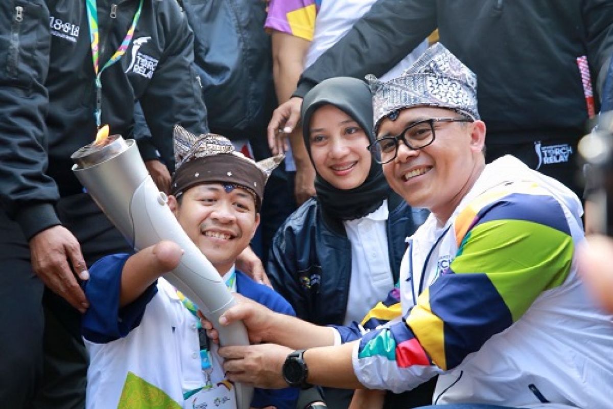 Fotografes Difabel Ikut Bawa Obor Asian Games