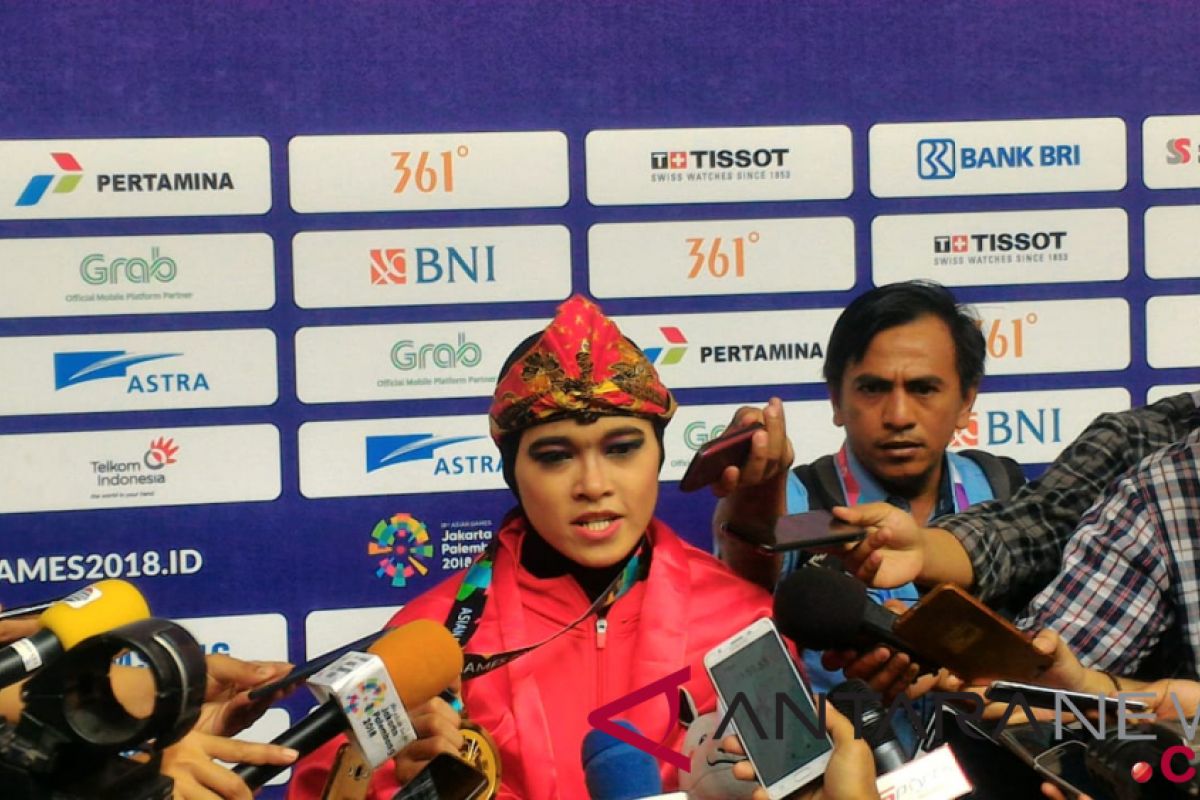 Asian Games (pencak silat) - Puspa Arumsari won Indonesia`s first gold medal in pencak silat