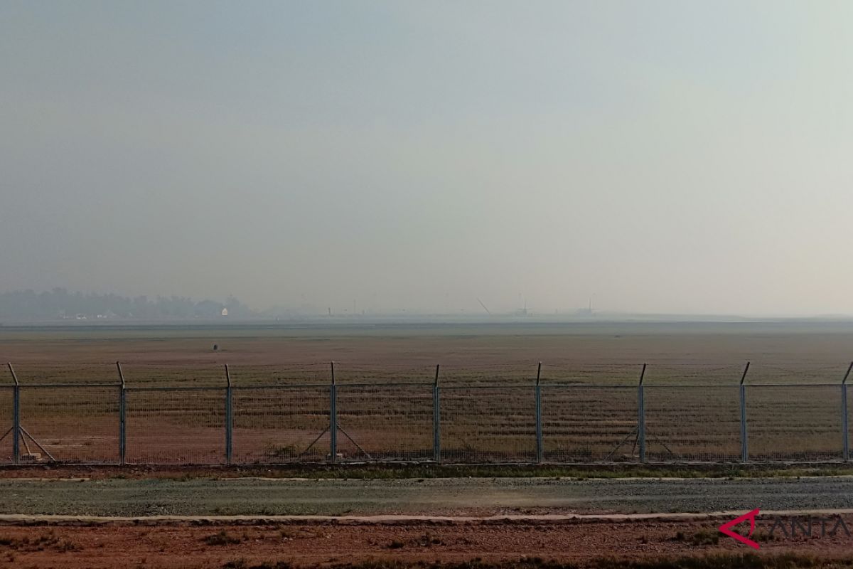 Syamsudin Noor Airport is shrouded in smoke