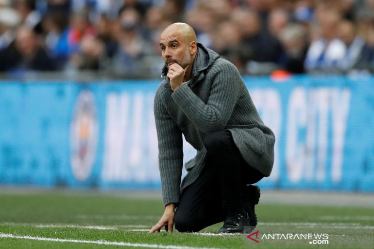 Guardiola tak mau sesumbar soal caturgelar