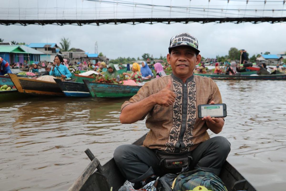 Pasar Terapung saksi arti hadirnya program JKN-KIS