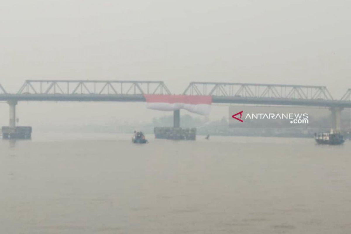 Red and White hoisted at Kapuas River marking Independence Day