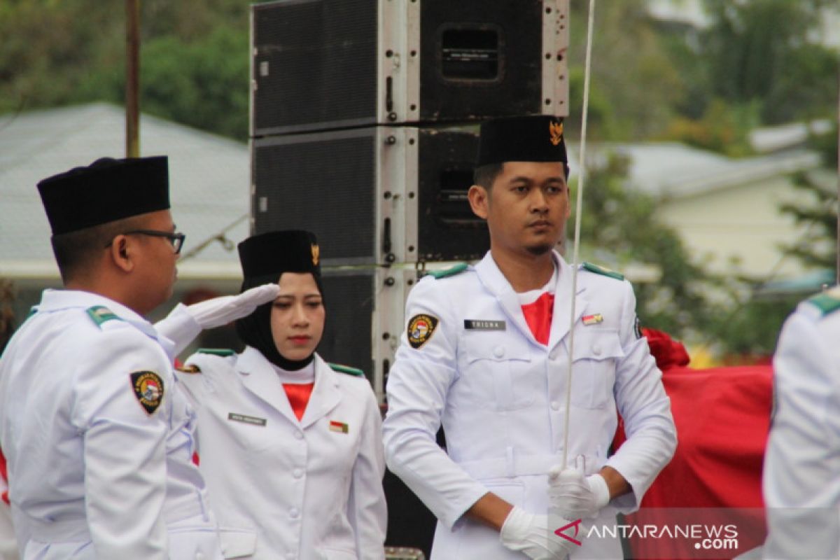 Indonesian migrant worker becomes commander in flagnhoisting ceremony