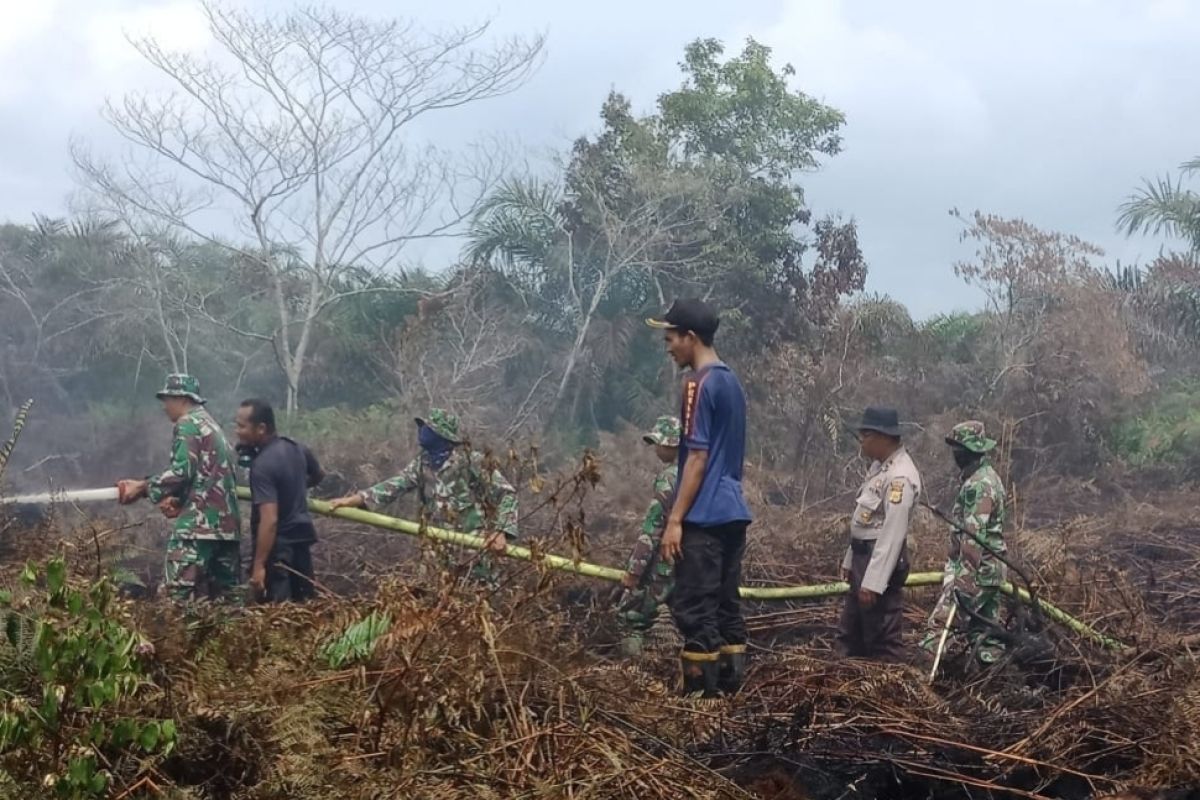 Firefighters attempt to extinguish fire in West  Aceh