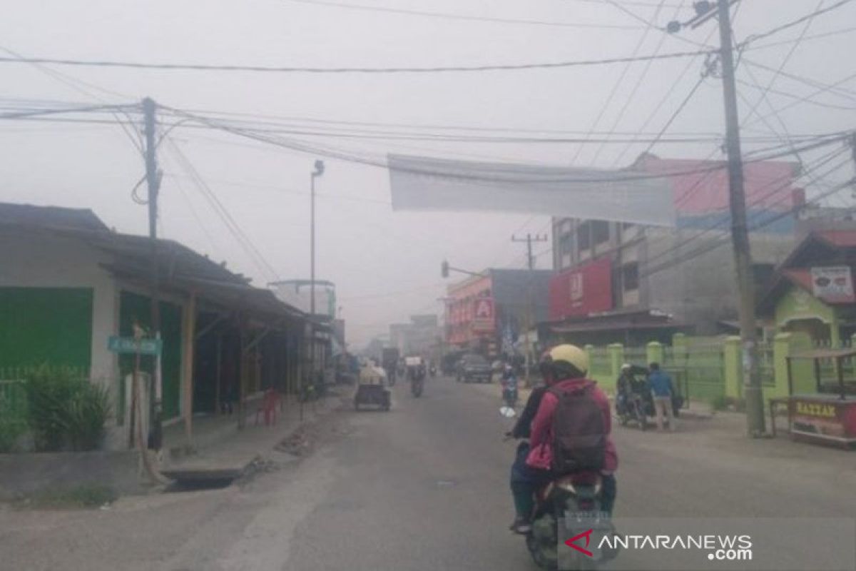 Kabut asap masih selimuti tiga daerah meski hujan turun