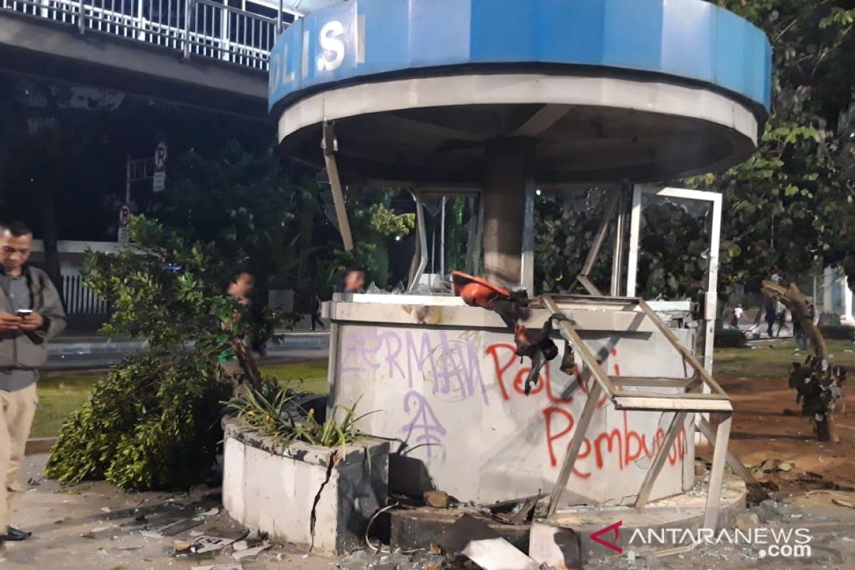 Demonstrators torch police post near Atmajaya campus in Jakarta