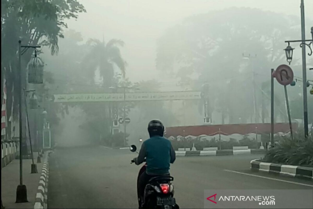 Hujan lebat belum berdampak usir kabut asap