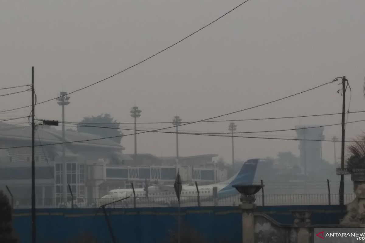 Forest fire-induced haze compels two planes to return to base