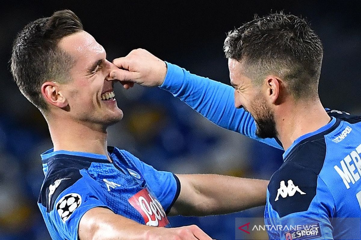 Milik sumringah kemas trigol Champions pertamanya yang loloskan Napoli ke babak 16 besar