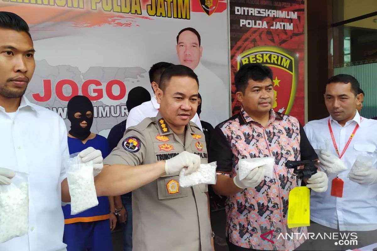 East Java police arrest two armed drug dealers