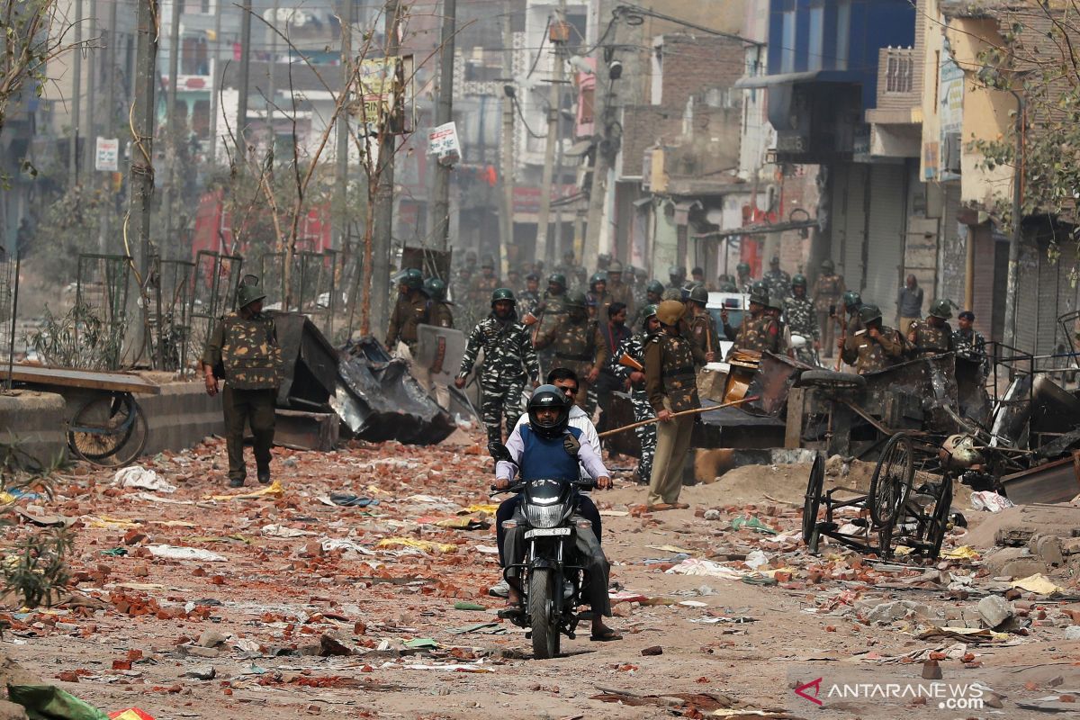 Di ibu kota India, kerusuhan perdalam  perpecahan antara Hindu, Muslim