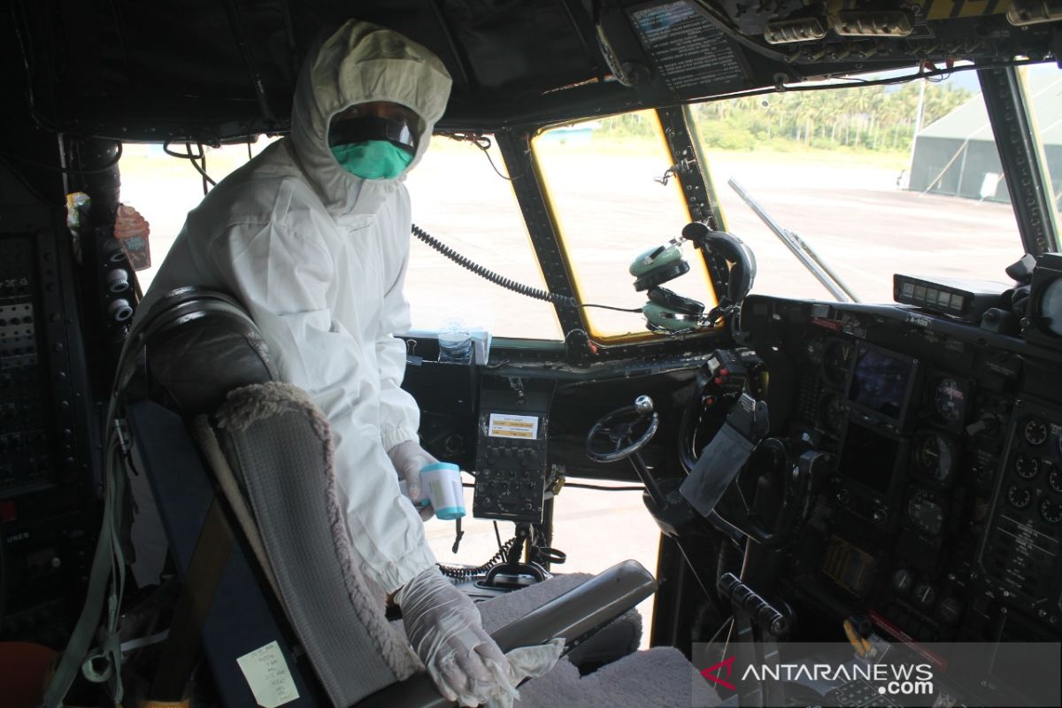 Disinfectant fluid sprayed on Indonesia's C-130 carrying medical cargo