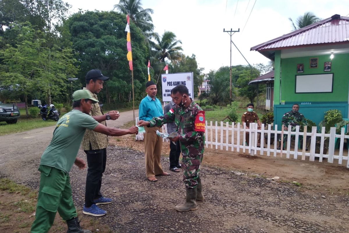 Satgas TMMD imbau warga gunakan masker