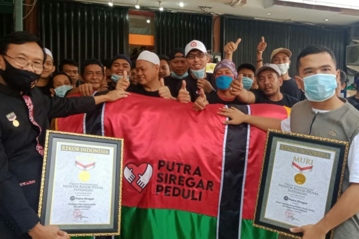 Putra Siregar raih dua rekor MURI sembelih 410 ekor hewan kurban