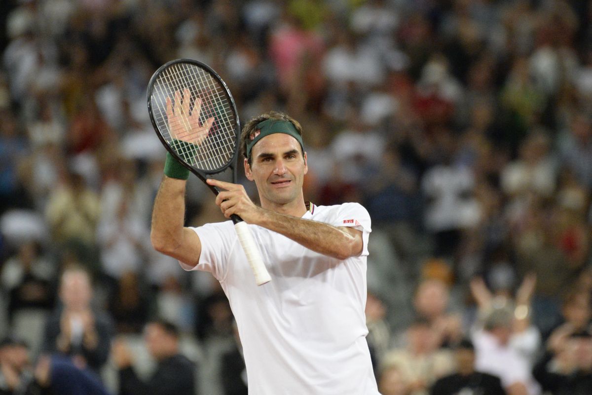 Ritual Federer usai kalahkan Evans