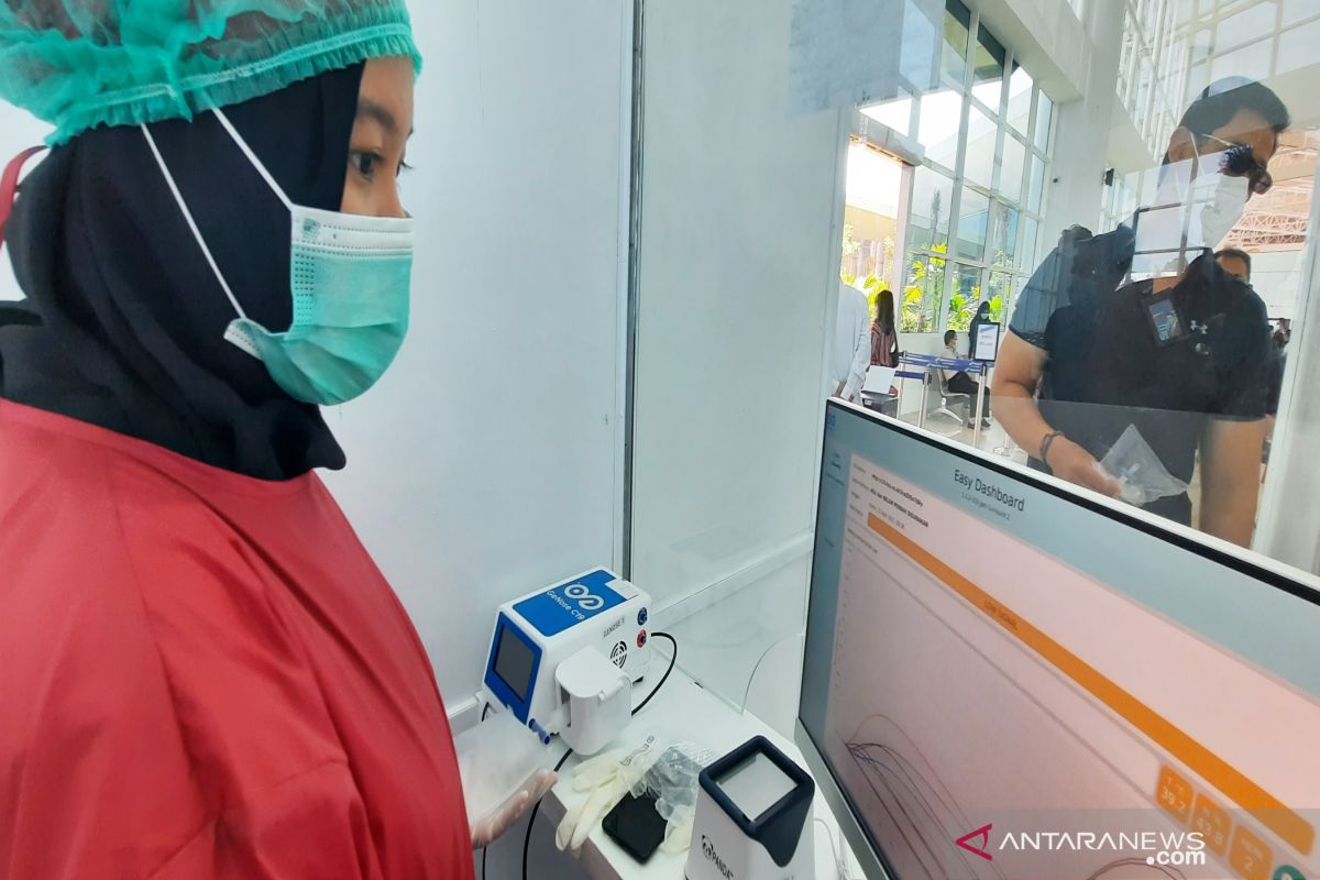 Every day Syamsudin Noor prepares 300 GeNose test bags