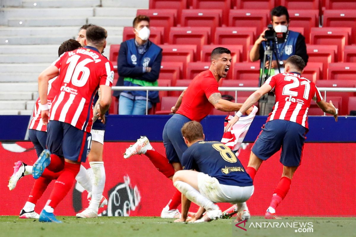 Menang dramatis atas Osasuna, Atletico tetap puncaki klasemen