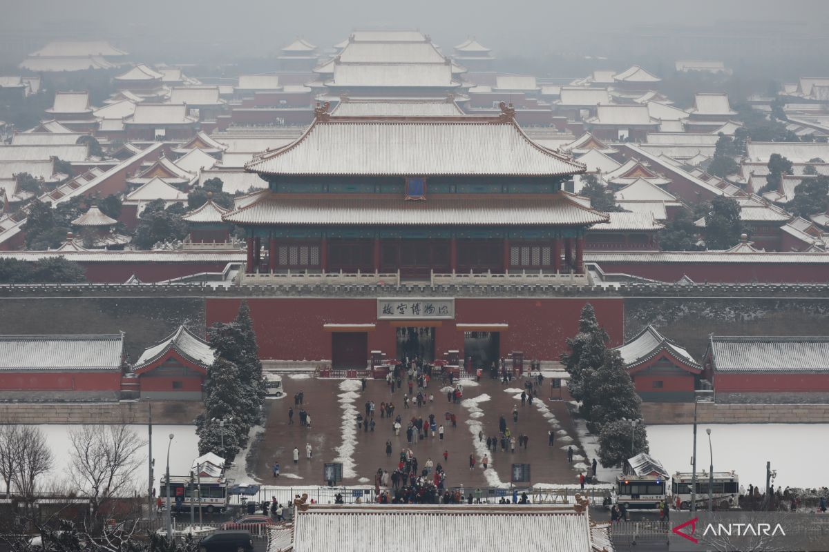 Mengabadikan Istana Kota Terlarang berselimut salju dari puncak Jingshan