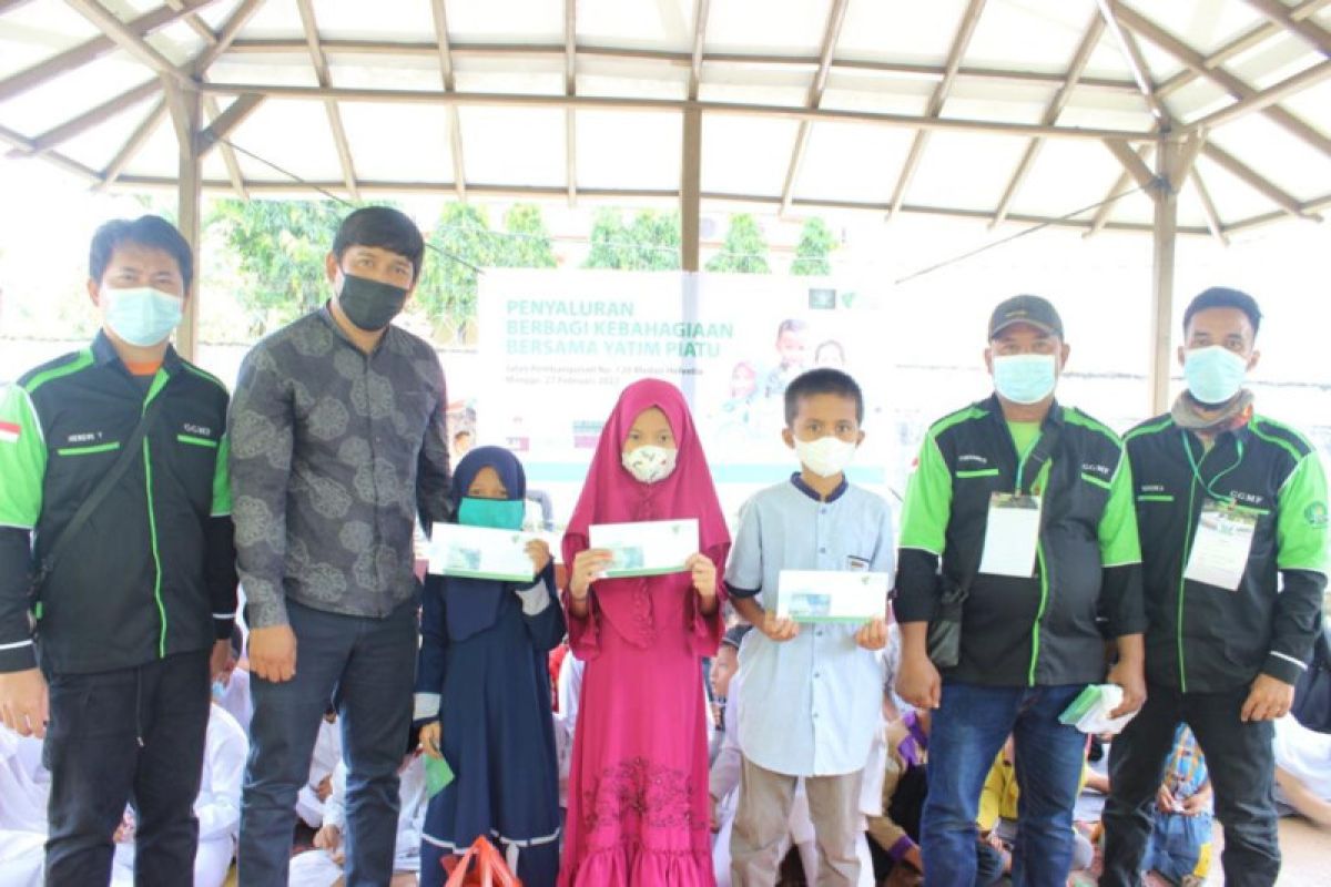 Komunitas Gojek Grab Medan Family-Dompet Dhuafa Waspada santuni anak yatim pengemudi ojek online