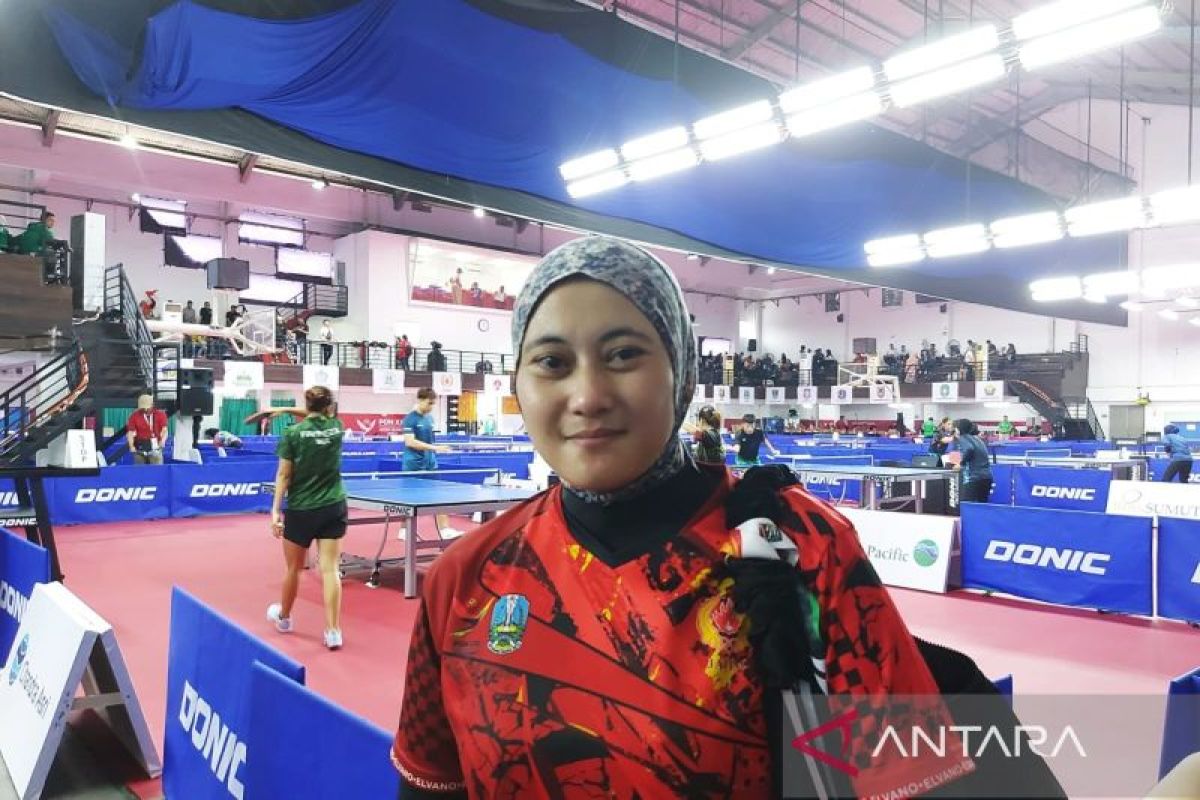 Cerita jilbab loreng atlet tenis meja Christine Ferliana yang disebut bawa hoki