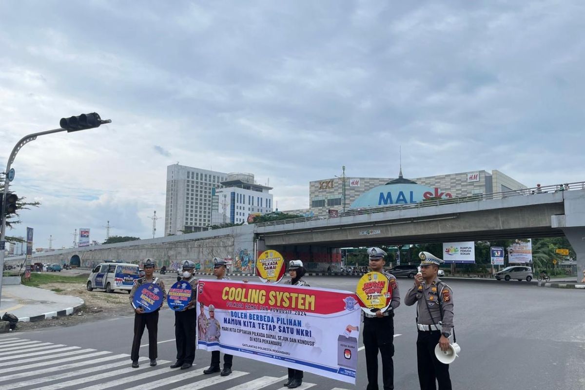 Satlantas Polresta Pekanbaru sapa pengendara dan imbau pilkada damai