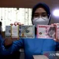 Nilai tukar Rupiah menguat seiring ekspektasi berakhirnya pengetatan moneter AS