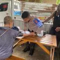 Satgas Keladi Sagu Polres Jayapura melakukan pemeriksaan kesehatan warga