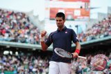 Djokovic dan Del Potro Melaju