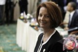 Perdana Menteri Australia Julia Gillard bersiap mengikuti Konferensi Tingkat Tinggi (KTT) ke-7 Asia Timur tahun 2012 di Peace Palace, Phnom Penh, Kamboja, Selasa (20/11). Pertemuan KTT ke-7 Asia Timur yang dihadiri oleh 10 pemimpin negara-negara ASEAN dan delapan mitra wicaranya yakni Amerika Serikat, China, Jepang, India, Korea Selatan, Rusia, Australia serta Selandia Baru tersebut membahas soal review arah kerjasama negara-negara di kawasan Asia Timur. FOTO ANTARA/Widodo S. Jusuf