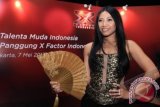 Penyanyi Internasional Anggun C. Sasmi hadir dalam konfrensi pers Panggung X Factor Indonesia di Jakarta, Rabu (8/5). Anggun harus menetap selama empat bulan di Indonesia untuk menjadi juri X Factor Indonesia. FOTO ANTARA/Teresia May/Spt/13