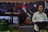 : Plt Wali Kota Medan Dzulmi Eldin membacakan pidato sambutannya saat membuka pameran foto 
