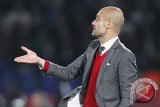 Pep Guardiola bersikeras perburuan gelar masih ketat