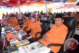 Suasana sidang paripurna HUT Kabupaten Gorontalo Utara ke-8, beberapa anggota DPRD dengan seragam oranye. (foto adv/Susanti Sako)