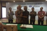 Direktur Utama Semen Indonesia, Suparni dan Direktur Bisnis Korporasi BNI Herry Sidharta saat penandatanganan kerjasama di Gedung Kementerian Badan Usaha Milik Negara (BUMN). (Foto Istimewa)