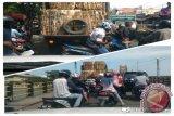 Sebuah truk bermuatan berat berupa karton mogok ketika menaiki Jembatan Pasar Lama Banjarmasin yang setiap saat padat, sehingga sempat membuat kemacetan ke dya arah menuju jembatan yang sudah berusia tua itu. Foto Antaranews.com/AHM